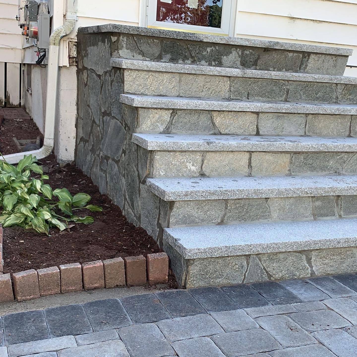 Granite steps on a fieldstone base in Massachusetts